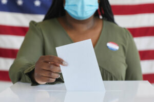 African Woman Voting in Pandemic Close Up