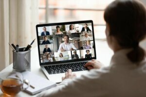 On laptop diverse people collage webcam view over woman shoulder