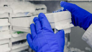 Scientific manipulating tests in bioscience laboratory freezer. Concept of science, laboratory and study of diseases. Coronavirus (COVID 19) treatment developing.