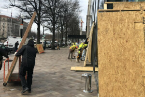 Boards go up around businesses near Freedom Plaza ahead of the pro Trump rallies in D.C.