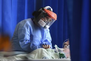 Virus Outbreak Britain Milestone