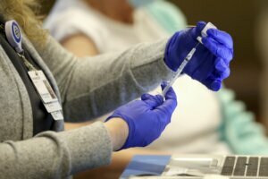 Virus Outbreak US Surge