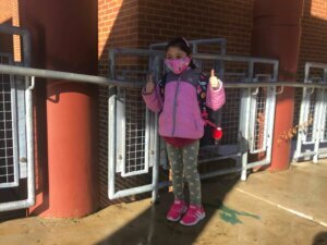 A kindergartener returns to Graham Road Elementary in Fairfax County, Virginia.