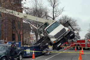 A crane tipped over at a Northwest D.C. construction site Wednesday morning, leaving at least one worker seriously hurt.