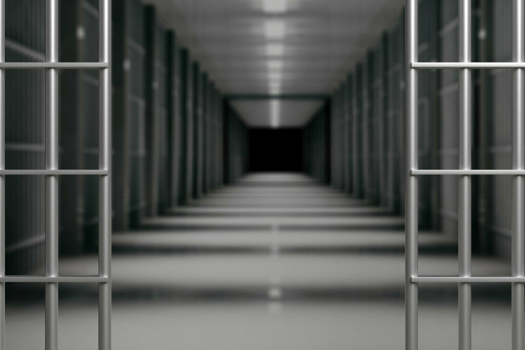 Prison interior. Jail cells and shadows, dark background. 3d illustration