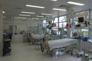 Intensive care unit in hospital, beds with monitors, ventilators, a place where can be treated patients with pneumonia caused by coronavirus covid 19.