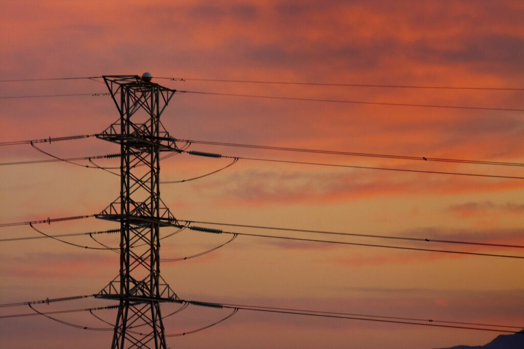 Electrical tower and orange sky