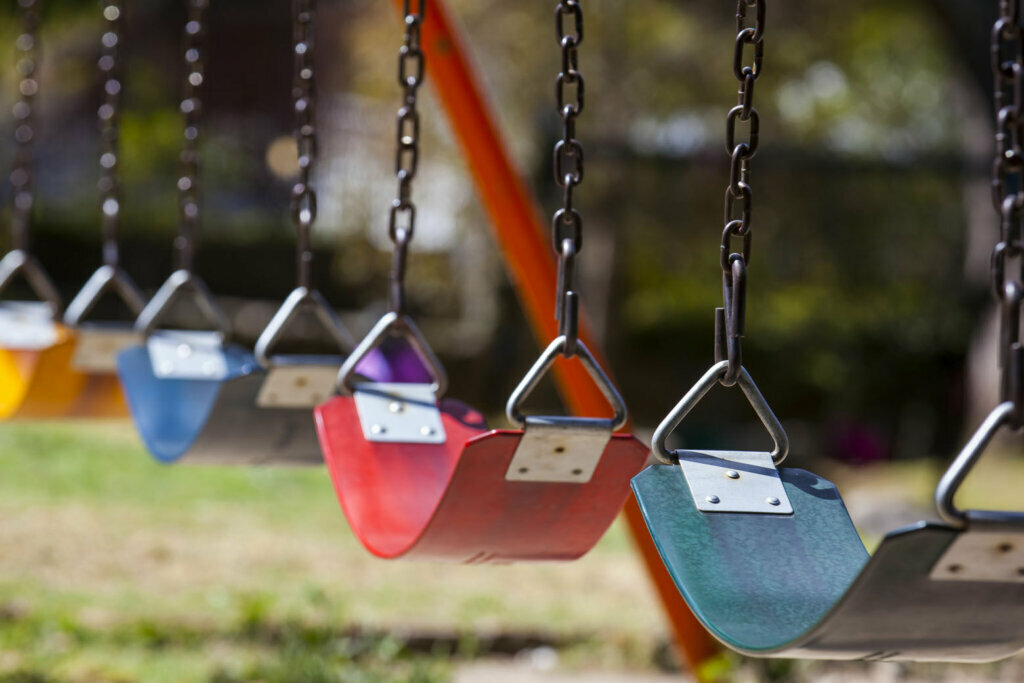 Empty colorful swings at the park