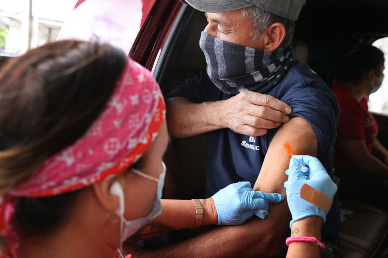 MLB Hall Of Famer Cal Ripken Jr. And Maryland Governor Hogan Tour Mass Vaccination Site