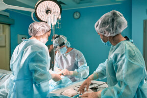 Surgeons team in the operating room, portraits close up. modern operating, plastic surgery. Beauty industry