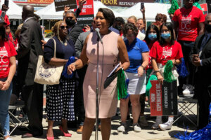 D.C. Mayor Muriel Bowser declares that "D.C. is open!" outside Ben's Chili Bowl on Wednesday.