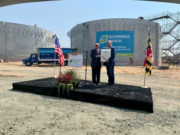 By the end of 2021, Bioenergy Devco will begin operating Maryland’s largest anaerobic digester located on Maryland Food Center Authority campus, one of the largest food terminals on the East Coast. The facility will be able to divert 125,000 tons of organic waste per year, according to Bioenergy Devco. Gov. Lawrence J. Hogan Jr. (R) gives a certification of recognition to Shawn Kreloff, chief executive officer of Bioenergy Devco. Photo by Elizabeth Shwe.