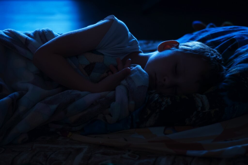 Six,Years,Old,Child,Sleeping,In,Bed,At,Night,,The