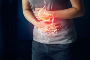 Woman touching stomach painful suffering from stomachache causes of menstruation period, gastric ulcer, appendicitis or gastrointestinal system disease. Healthcare and health insurance concept