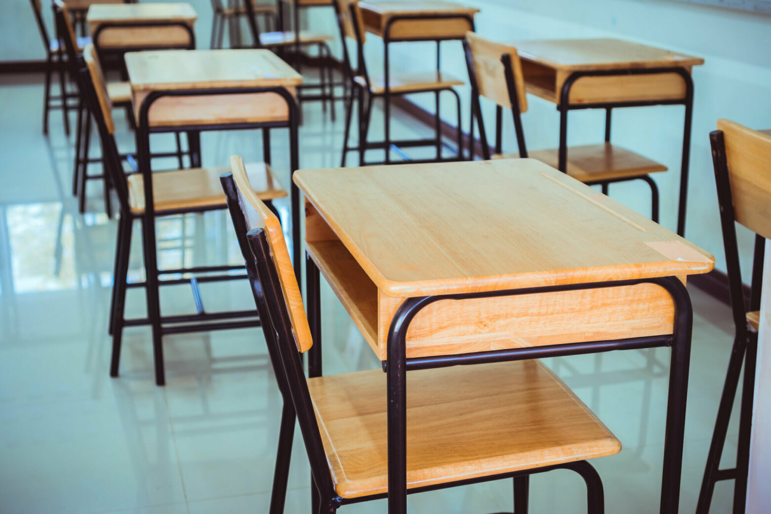 Back to school concept. School empty classroom, Lecture room with desks and chairs iron wood for studying lessons in highschool thailand without young student, interior of secondary education