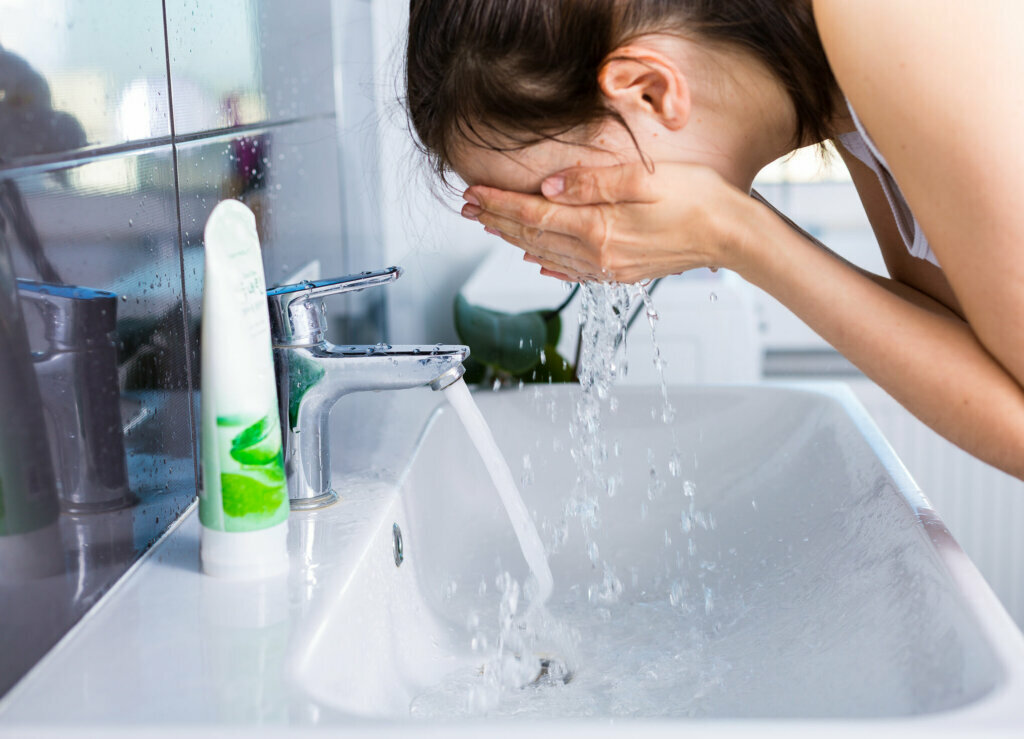 Woman washing up in the morning