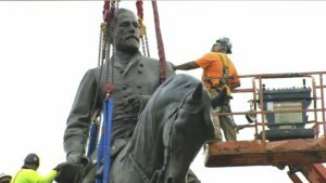 Crews harness the statue of Confederate General Robert E. Lee in Richmond before its removal Wednesday.