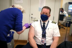 United Airlines Employees Receive COVID 19 Vaccination At O'Hare Airport