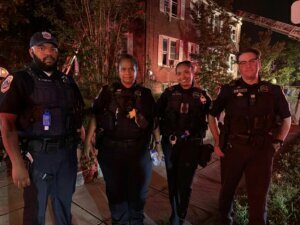 Fourth District MPD officers who responded to the fire are left to right: Officer Domond, Sergeant Robinson, Officer Taylor, Master Patrol Officer Mason. (Courtesy, DC Fire EMS)