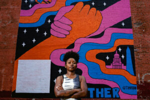 Mural at 2452 18th Street NW, calling attention to the issue of hunger and kids in D.C. with muralist Tenbeete Solomon, also known as Trap Bob.