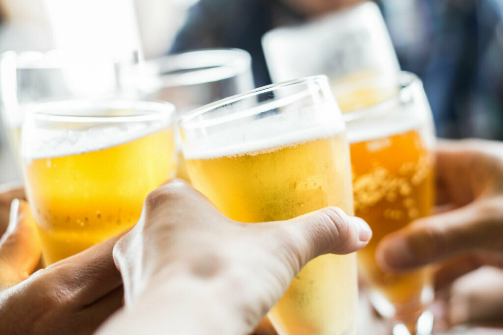 Friends toasting with beer