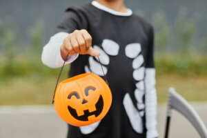 Boy Holding Halloween Bucket