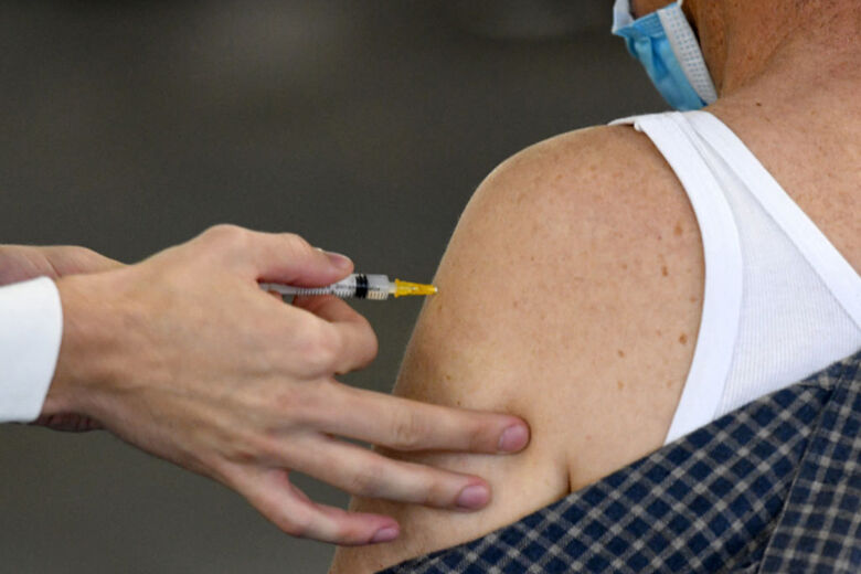 Medical staff vaccinate citizens against Covid