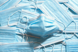 Medical masks top view. Pile of blue protective masks