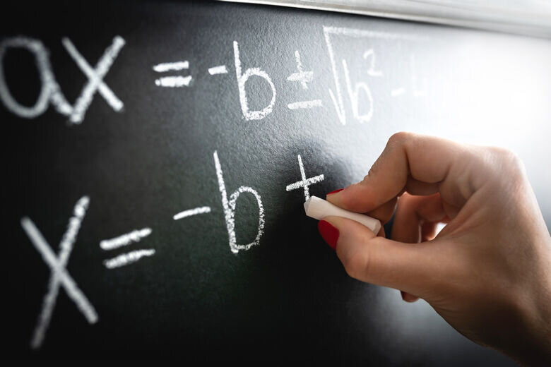 Math equation or calculation on a chalkboard