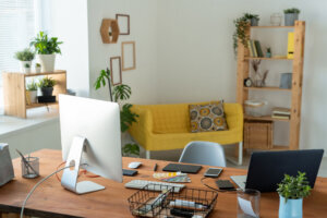 Workplace of contemporary manager or freelancer with computer monitor on table