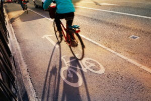 Bicyclist crossing bridge in bike lane