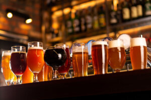 Tasty craft beer on bar table