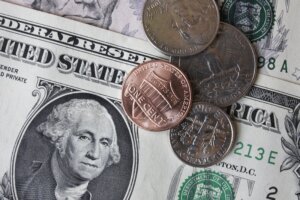 Close up of dollar banknotes and coins