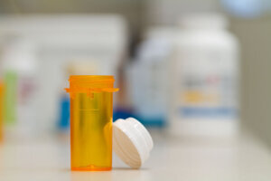Empty pharmacy vial and cap