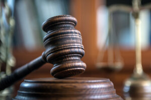 Law and Justice concept. Mallet of the judge, books, scales of justice.