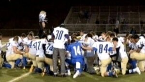 Coach suspended for continuing prayer with teams