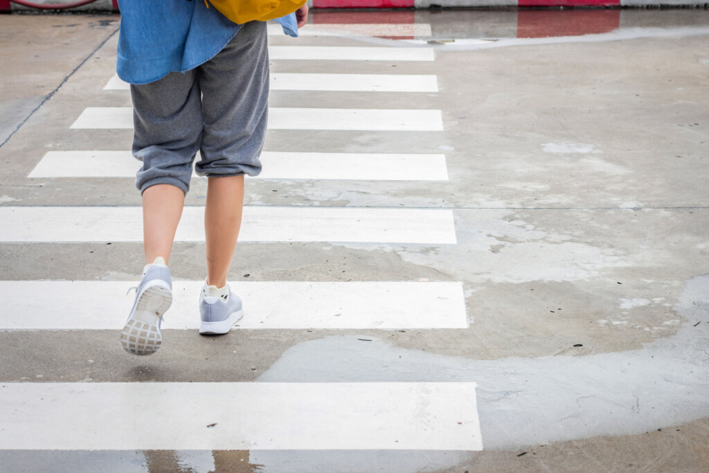 Walking across the road on crosswalk