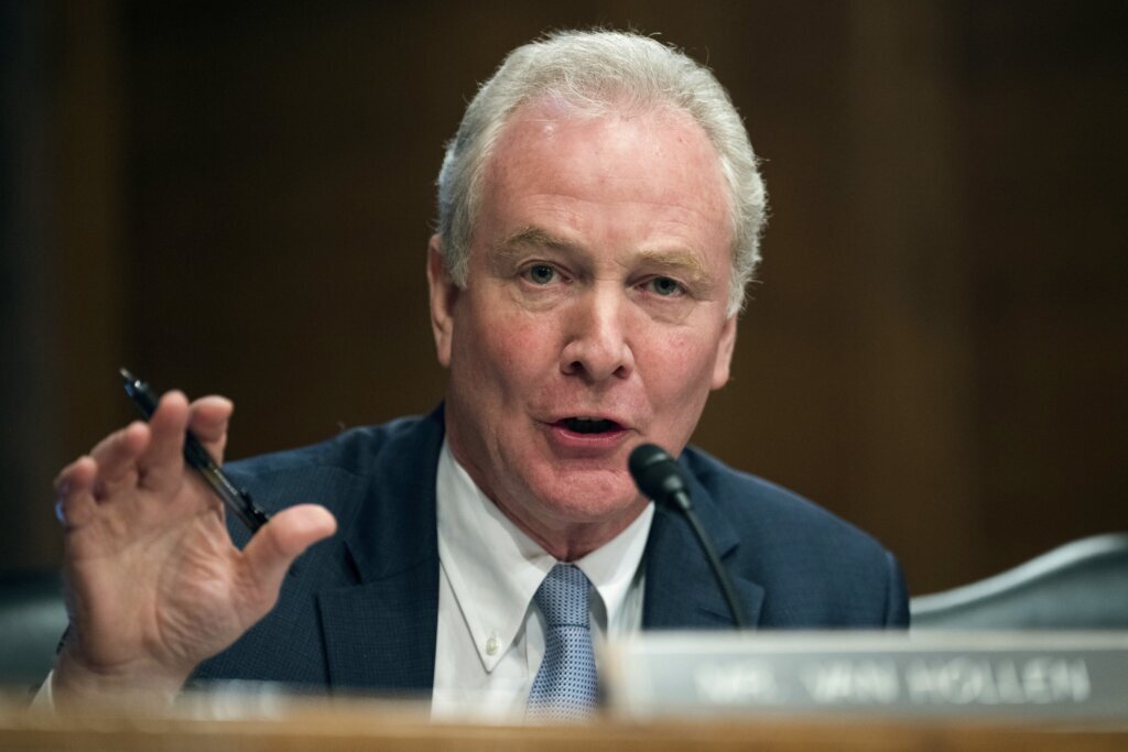 Chris Van Hollen speaking into a mic at a hearing
