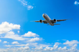 Aerial flying airplane and sky landscape close up