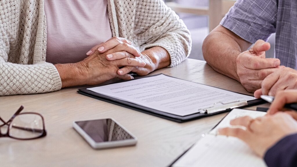 Senior couple planning their investments with financial advisor