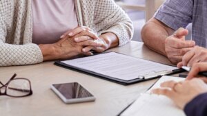 Senior couple planning their investments with financial advisor