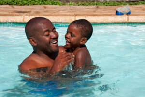 African father son swim