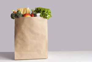 Paper bag with food gray background