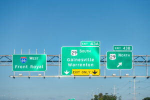 Gainesville, Virginia interstate highway i 66 in Virginia driving point of view in Washington DC metro area to Front Royal overhead sign