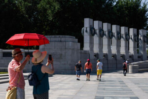 Tourists at the World War 2 memorial in D.C.