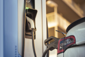 Electric car charging the battery at the charging station