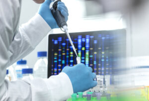 Scientist pipetting sample into a vial for DNA testing