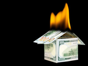 One hundred dollar bills house on fire