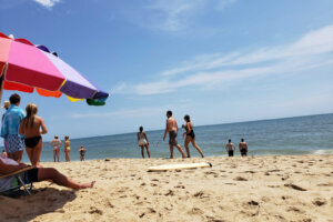 People are seen on the beach at Ocean City, Maryland. (WTOP/Colleen Kelleher)