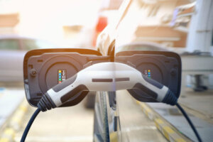 Charging modern electric car battery on the street which are the
